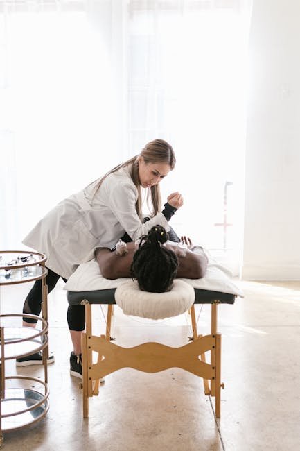 A doctor performing cupping therapy on a patient in a bright clinical setting. Ideal for healthcare themes.